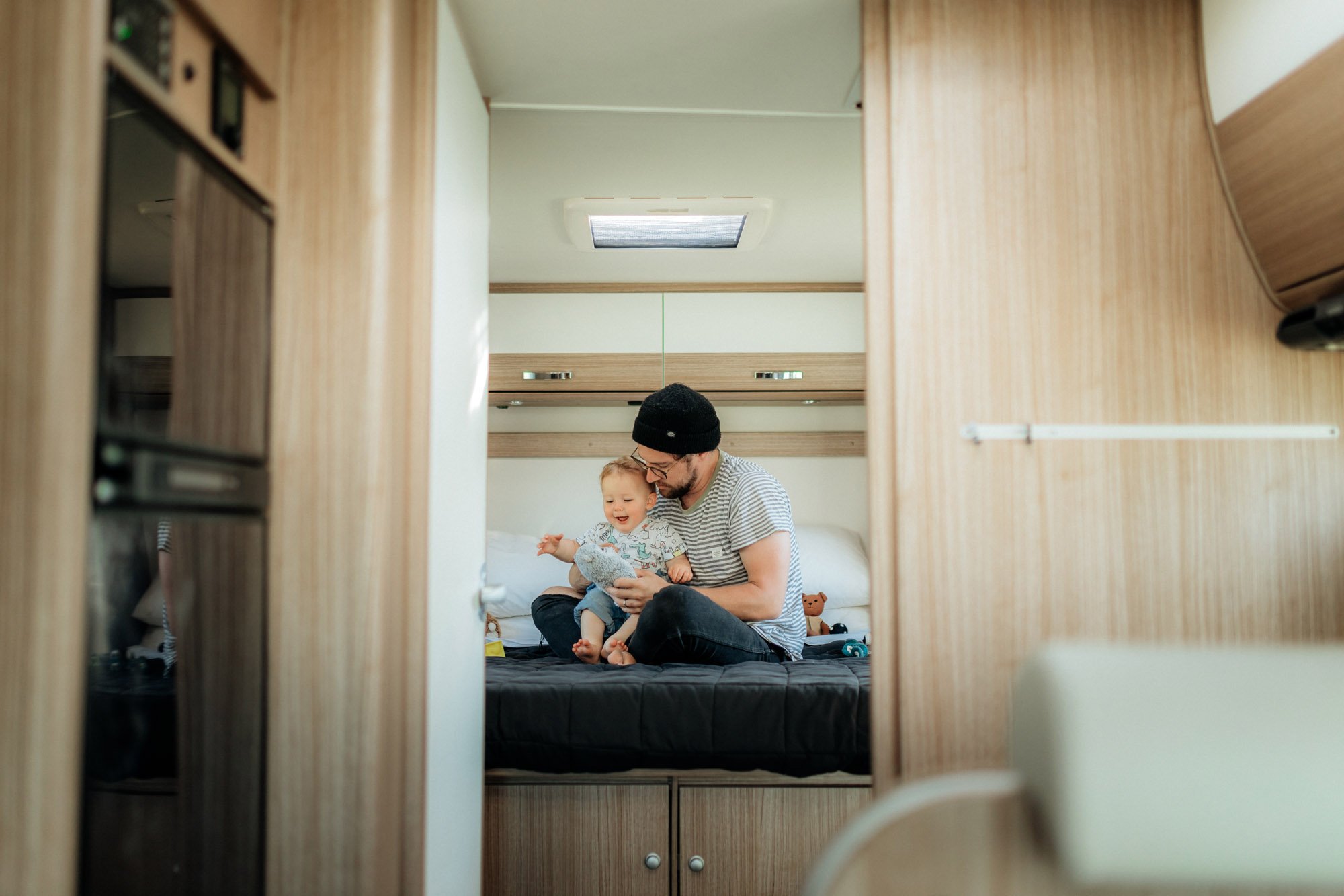 baby and dad on bed in motorhome 2