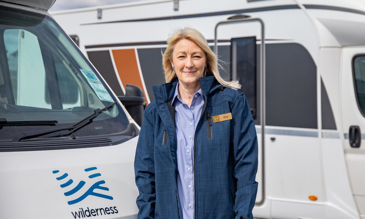 A Wilderness motorhome team member excited to greet her guests