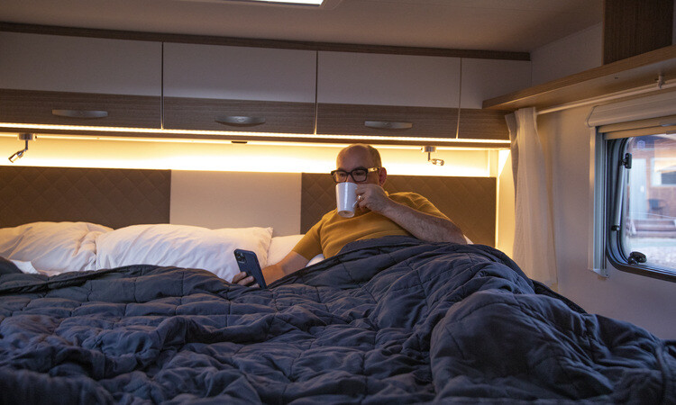 A man enjoying warmth and comfort in his Wilderness motorhome