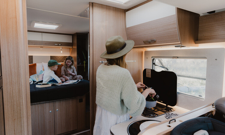 Family relaxing in a four berth Wilderness motorhome