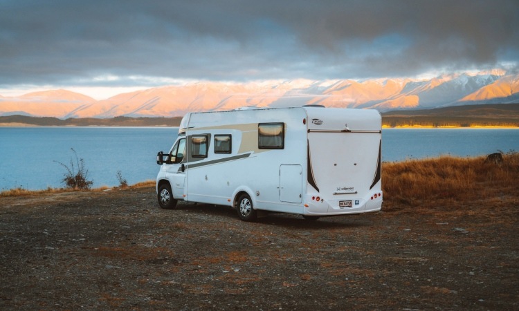 A Wilderness motorhome parked up infront of a lake